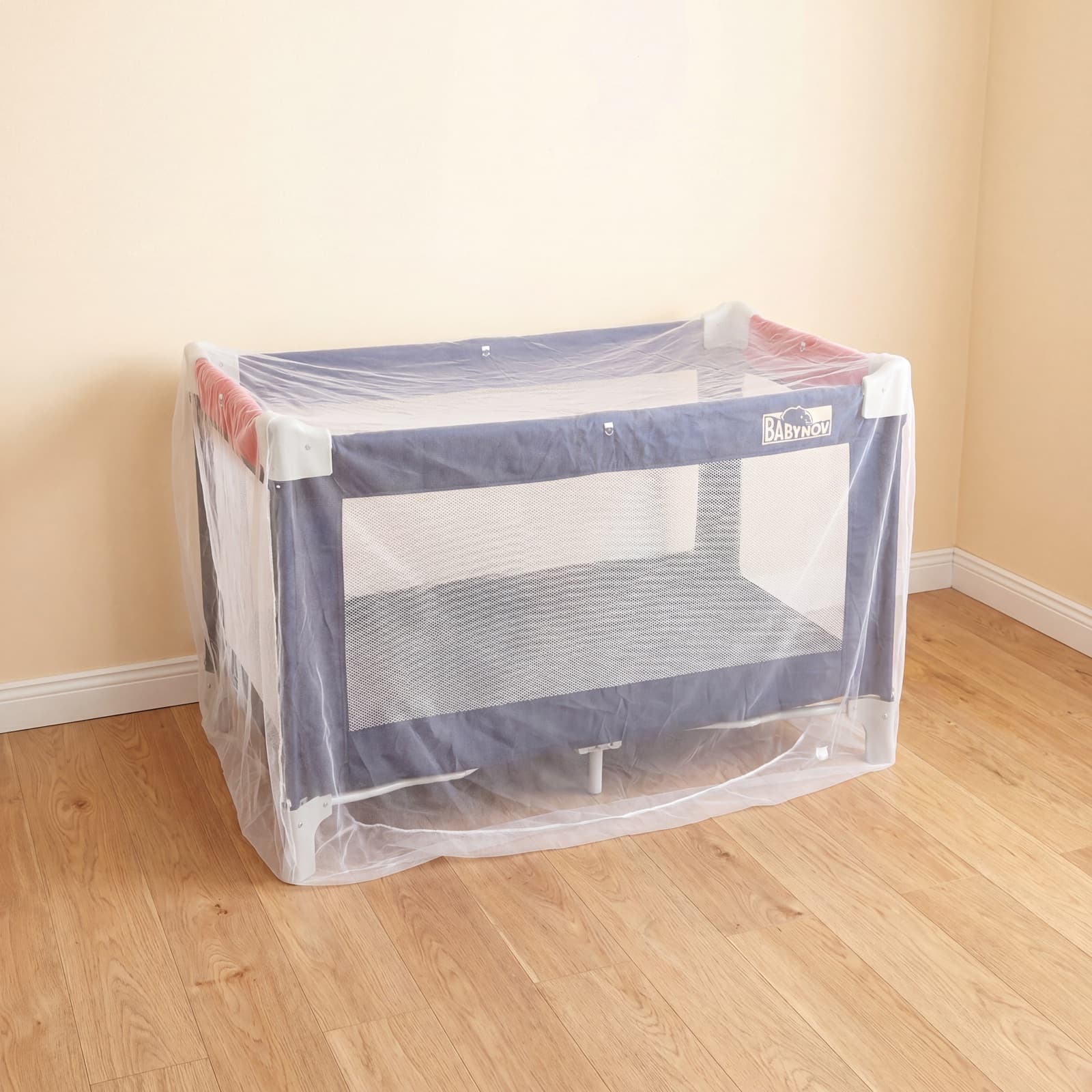 The Mosticare Bambino Dorme net fitted over a folding travel cot.