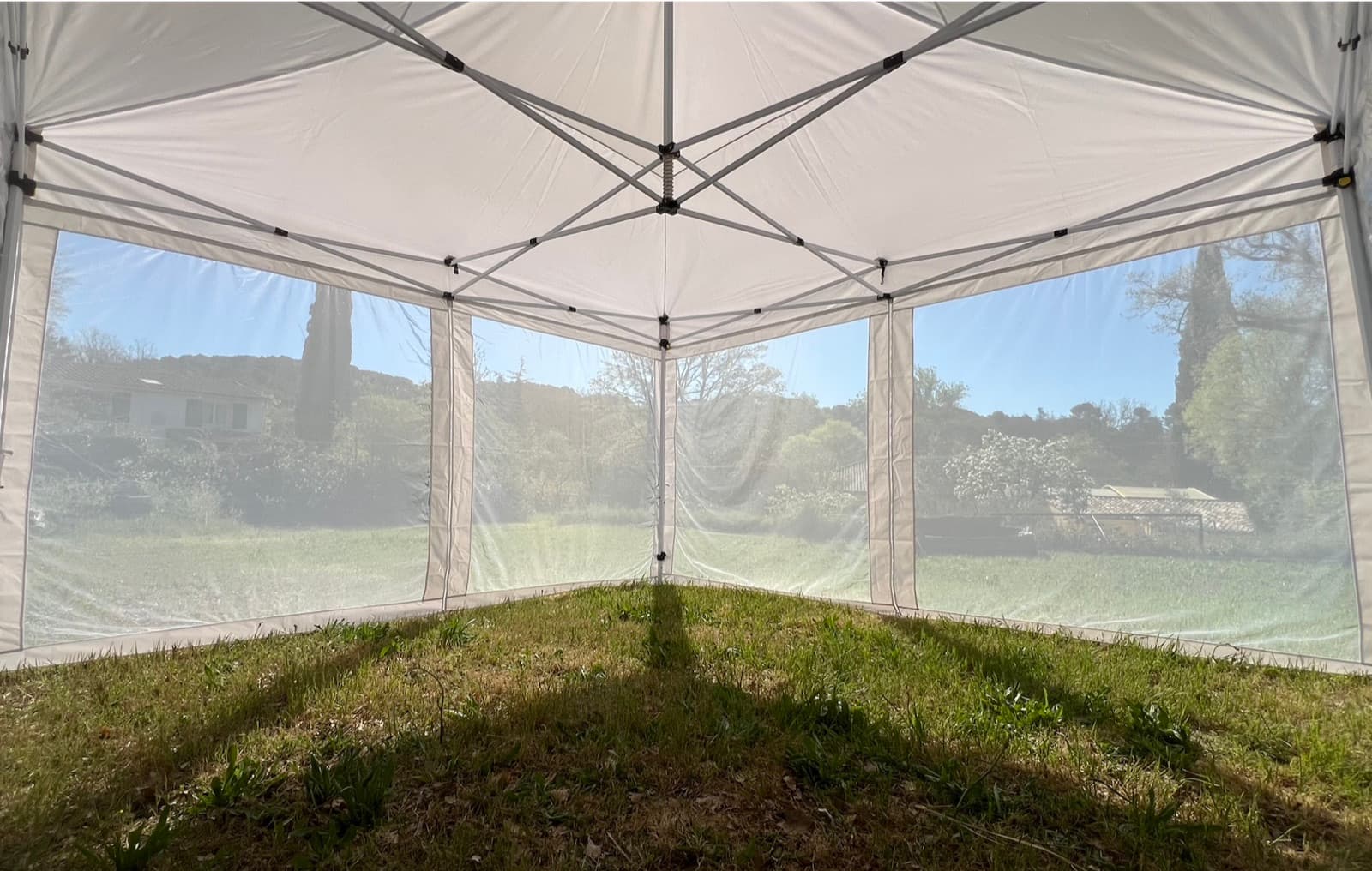 View from inside the Mosticare Terrazza gazebo, looking out through its fine mesh walls.